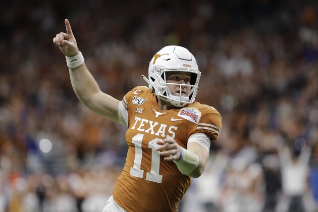 Texas quarterback Sam Ehlinger celebrates a touchdown against Utah during the first half of the Alamo Bowl NCAA college football game in San Antonio, Tuesday, Dec. 31, 2019. (AP Photo/Austin Gay)