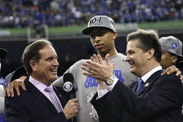 Kentucky head coach John Calipari, right, and forward Anthony Davis, center, talk with CBS announcer jim Nantz after the NCAA Final Four tournament college basketball championship game Monday, April 2, 2012, in New Orleans. Kentucky beat Kansas 67-59. (AP Photo/David J. Phillip)