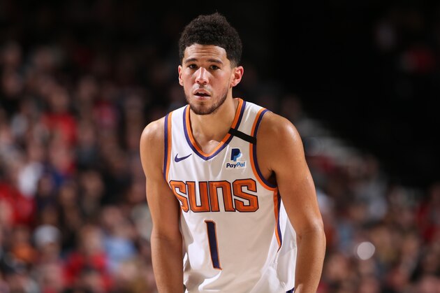 PORTLAND, OR - MARCH 10: Devin Booker #1 of the Phoenix Suns looks on during the game on March 10 , 2020 at the Moda Center Arena in Portland, Oregon. NOTE TO USER: User expressly acknowledges and agrees that, by downloading and or using this photograph, user is consenting to the terms and conditions of the Getty Images License Agreement. Mandatory Copyright Notice: Copyright 2020 NBAE (Photo by Sam Forencich/NBAE via Getty Images) PORTLAND, OR - MARCH 10: Devin Booker #1 of the Phoenix Suns looks on during the game on March 10 , 2020 at the Moda Center Arena in Portland, Oregon. NOTE TO USER: User expressly acknowledges and agrees that, by downloading and or using this photograph, user is consenting to the terms and conditions of the Getty Images License Agreement. Mandatory Copyright Notice: Copyright 2020 NBAE (Photo by Sam Forencich/NBAE via Getty Images)