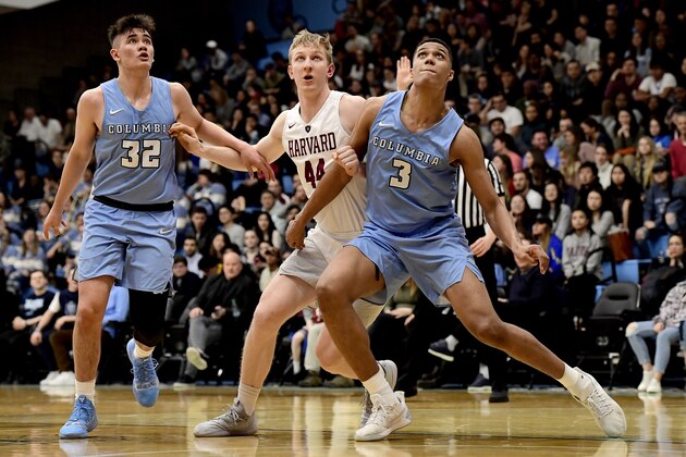 NEW YORK, NEW YORK - MARCH 09:  Henry Welsh #44 of the Harvard Crimson battles for position with Maka Ellis #32 and Patrick Tape #3 of the Columbia Lions at Frances S. Levien Gymnasium on March 09, 2019 in New York City. (Photo by Steven Ryan/Getty Images)