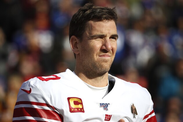 New York Giants quarterback Eli Manning looks on during the national anthem prior to an NFL football game against the Washington Redskins, Sunday, Dec. 22, 2019, in Landover, Md. (AP Photo/Alex Brandon)