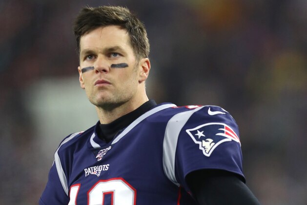 FOXBOROUGH, MASSACHUSETTS - JANUARY 04: Tom Brady #12 of the New England Patriots looks on from the sideline during the the AFC Wild Card Playoff game against the Tennessee Titans at Gillette Stadium on January 04, 2020 in Foxborough, Massachusetts. (Photo by Maddie Meyer/Getty Images)