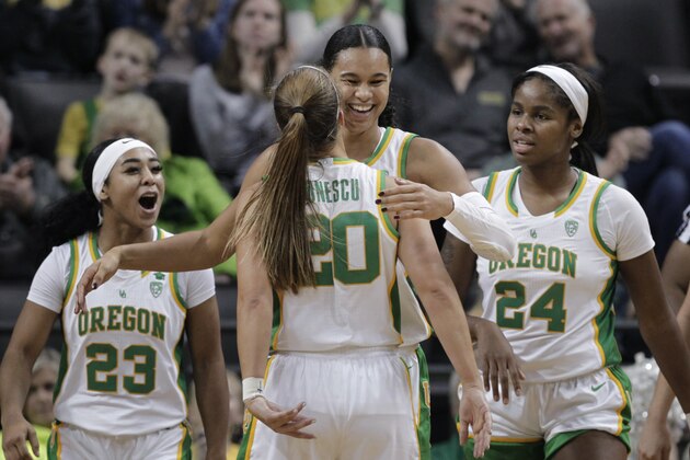 Oregon's Minyon Moore, Sabrina Ionescu, Satou Sabally and Ruthy Hebard, from left, celebrate a play during the third quarter of the team's NCAA college basketball game against Colorado in Eugene, Ore., Friday, Jan. 3, 2020. (AP Photo/Chris Pietsch) Oregon's Minyon Moore, Sabrina Ionescu, Satou Sabally and Ruthy Hebard, from left, celebrate a play during the third quarter of the team's NCAA college basketball game against Colorado in Eugene, Ore., Friday, Jan. 3, 2020. (AP Photo/Chris Pietsch)