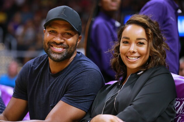 LOS ANGELES, CA - AUGUST 05: Retired NBA player Derek Fisher and Gloria Govan take in the Phoenix Mercury vs Los Angeles Sparks during a WNBA basketball game at Staples Center on August 5, 2018 in Los Angeles, California.  (Photo by Leon Bennett/Getty Images)