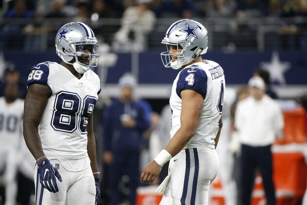 Dallas Cowboys wide receiver Dez Bryant (88) talks with quarterback Dak Prescott (4) during an NFL football game against the Washington Redskins on Thursday, Nov. 30, 2017, in Arlington, Texas. (AP Photo/Michael Ainsworth)