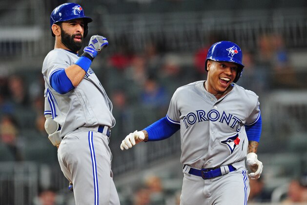 ATLANTA, GA - MAY 18: Marcus Stroman #6 (R) of the Toronto Blue Jays is congratulated by Jose Bautista #19 after hitting a fourth inning solo home run against the Atlanta Braves at SunTrust Park on May 18, 2017 in Atlanta, Georgia. (Photo by Scott Cunningham/Getty Images)