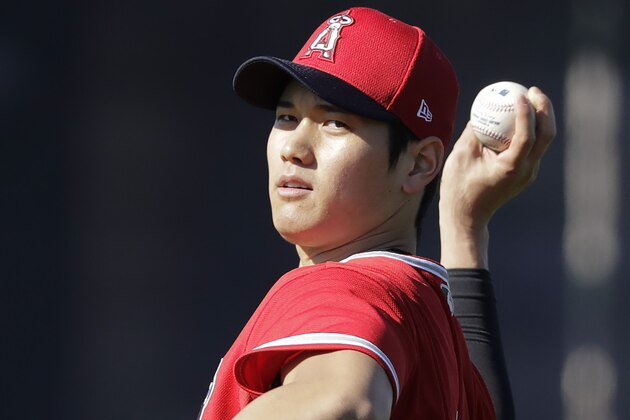 Los Angeles Angels' Shohei Ohtani throws during spring training baseball practice, Wednesday, Feb. 12, 2020, in Tempe, Ariz. (AP Photo/Darron Cummings)