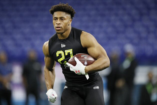 Wisconsin running back Jonathan Taylor runs a drill at the NFL football scouting combine in Indianapolis, Friday, Feb. 28, 2020. (AP Photo/Charlie Neibergall)