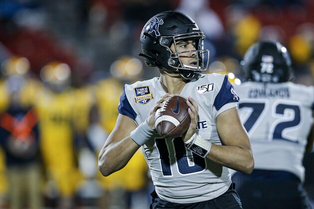 Utah State quarterback Jordan Love (10) looks to pass during the first half of the Frisco Bowl NCAA college football game against Kent State Friday, Dec. 20, 2019, in Frisco, Texas. Kent State won 51-41. (AP Photo/Brandon Wade)