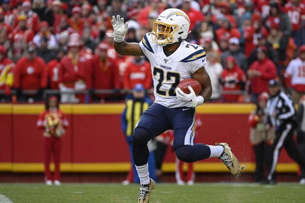 Los Angeles Chargers running back Justin Jackson (22) runs this kickoff back against the Kansas City Chiefs during the second half of an NFL football game in Kansas City, Mo., Sunday, Dec. 29, 2019. (AP Photo/Reed Hoffmann)