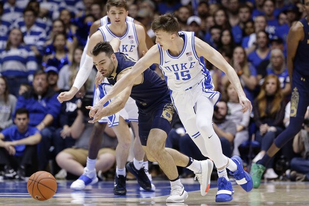 Duke guard Alex O'Connell (15) and Notre Dame guard Nikola Djogo chase the ball during the second half of an NCAA college basketball game in Durham, N.C., Saturday, Feb. 15, 2020. (AP Photo/Gerry Broome)