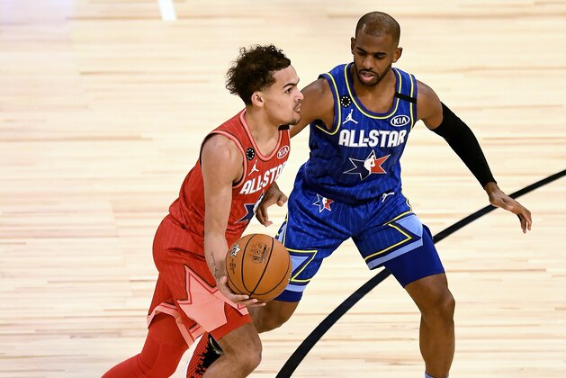 CHICAGO, ILLINOIS - FEBRUARY 16: Trae Young #24 of Team Giannis dribbles the ball while being guarded by Chris Paul #2 of Team LeBron in the fourth quarter during the 69th NBA All-Star Game at the United Center on February 16, 2020 in Chicago, Illinois. NOTE TO USER: User expressly acknowledges and agrees that, by downloading and or using this photograph, User is consenting to the terms and conditions of the Getty Images License Agreement. (Photo by Stacy Revere/Getty Images)