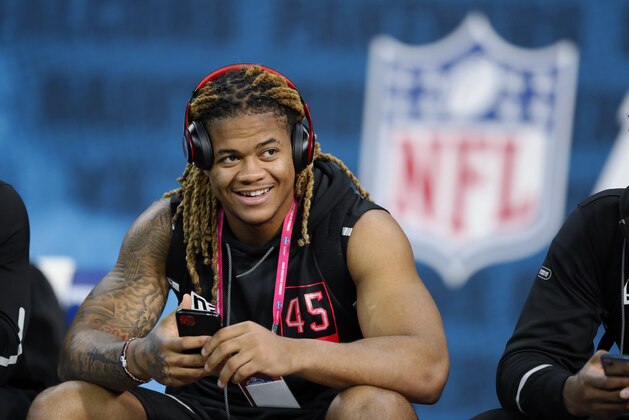 Ohio State defensive lineman Chase Young watches a drill at the NFL football scouting combine in Indianapolis, Saturday, Feb. 29, 2020. (AP Photo/Charlie Neibergall)