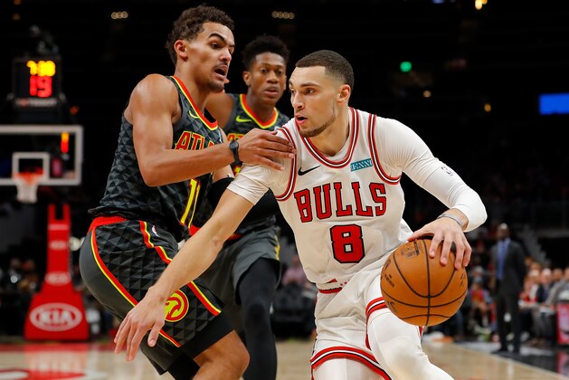 ATLANTA, GEORGIA - NOVEMBER 06:  Zach LaVine #8 of the Chicago Bulls drives against Trae Young #11 of the Atlanta Hawks in the second half at State Farm Arena on November 06, 2019 in Atlanta, Georgia.  NOTE TO USER: User expressly acknowledges and agrees that, by downloading and/or using this photograph, user is consenting to the terms and conditions of the Getty Images License Agreement.  (Photo by Kevin C. Cox/Getty Images)