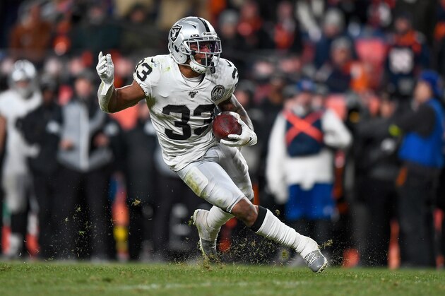 DENVER, CO - DECEMBER 29:  DeAndre Washington #33 of the Oakland Raiders carries the ball against the Denver Broncos in the fourth quarter of a game at Empower Field at Mile High on December 29, 2019 in Denver, Colorado.  (Photo by Dustin Bradford/Getty Images)