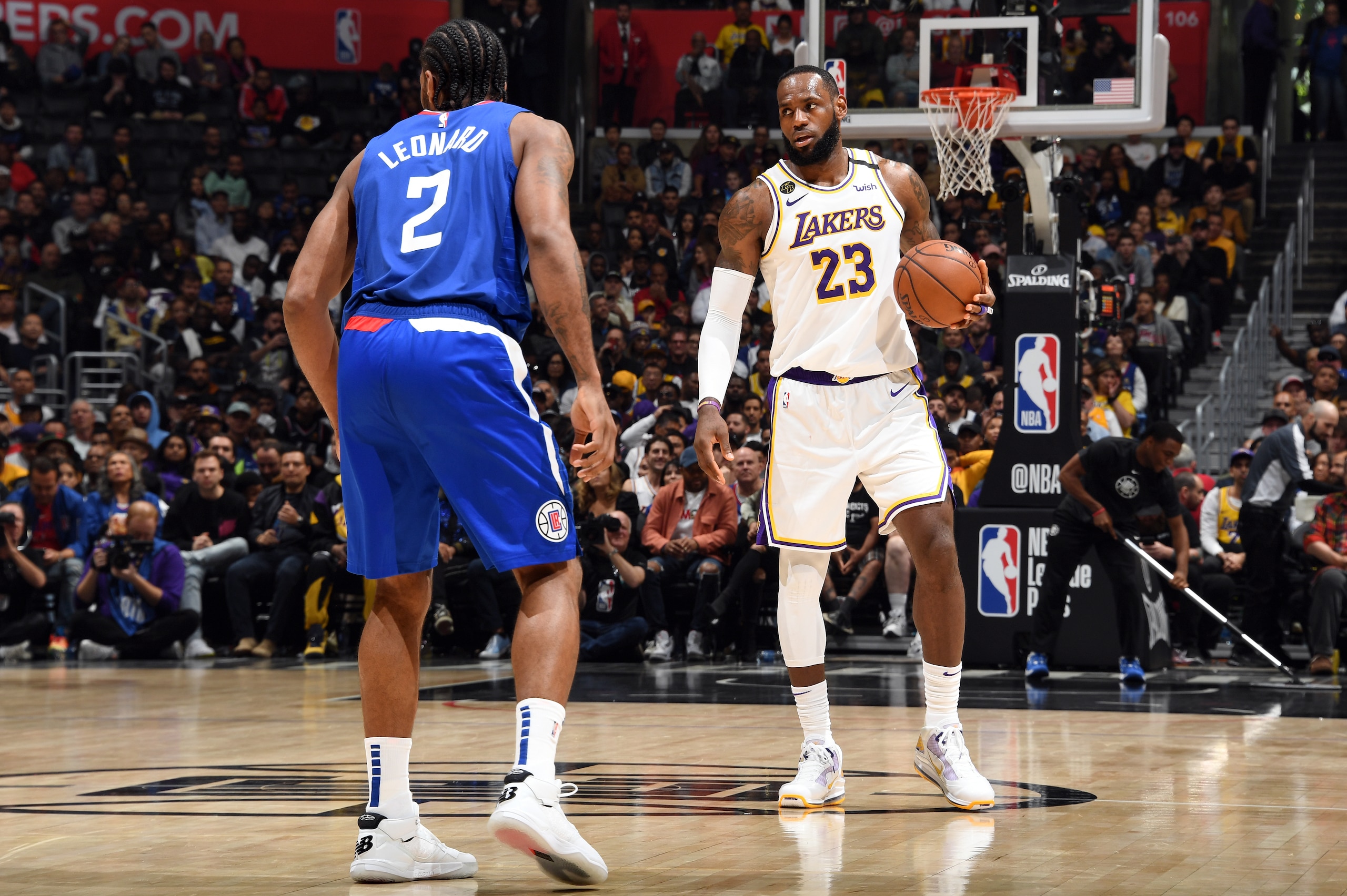 LOS ANGELES, CA - MARCH 8: Kawhi Leonard #2 of the LA Clippers plays defense while LeBron James #23 of the Los Angeles Lakers handles the ball on March 8, 2020 at STAPLES Center in Los Angeles, California. NOTE TO USER: User expressly acknowledges and agrees that, by downloading and/or using this Photograph, user is consenting to the terms and conditions of the Getty Images License Agreement. Mandatory Copyright Notice: Copyright 2020 NBAE (Photo by Andrew D. Bernstein/NBAE via Getty Images)