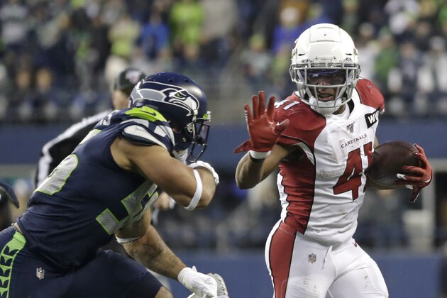 Arizona Cardinals running back Kenyan Drake fends off Seattle Seahawks linebacker Mychal Kendricks, left, as he rushes during the second half of an NFL football game, Sunday, Dec. 22, 2019, in Seattle. (AP Photo/Lindsey Wasson) Arizona Cardinals running back Kenyan Drake fends off Seattle Seahawks linebacker Mychal Kendricks, left, as he rushes during the second half of an NFL football game, Sunday, Dec. 22, 2019, in Seattle. (AP Photo/Lindsey Wasson)