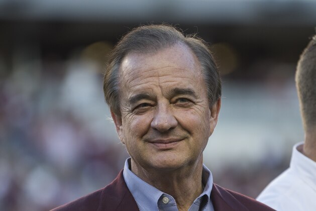 Texas A&M Chancellor John Sharp gives a Gig'Em before to the crowd at Kyle Field, before the start of an NCAA college football game between South Carolina and Texas A&M Saturday, Sept. 30, 2017, in College Station, Texas. (AP Photo/Sam Craft)