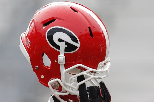 Georgia helmet in the air before a game against Georgia Tech of an NCAA college football game Saturday, Nov. 28, 2015, in Atlanta. (AP Photo/Brett Davis)