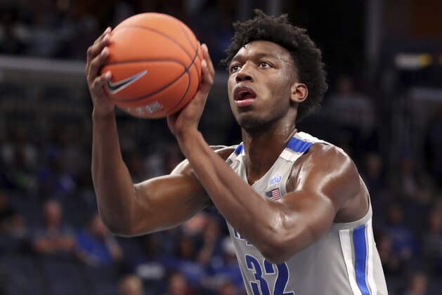 Memphis' James Wiseman (32) shoots a basket during the second half of an NCAA college basketball game against Illinois-Chicago, Friday, Nov. 8, 2019, in Memphis, Tenn. (AP Photo/Karen Pulfer Focht)