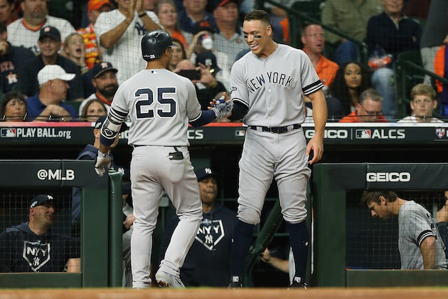 HOUSTON, TEXAS - OCTOBER 12: Gleyber Torres #25 of the New York Yankees is congratulated by his teammate Aaron Judge #99 after hitting a solo home run against the Houston Astros during the sixth inning in game one of the American League Championship Series at Minute Maid Park on October 12, 2019 in Houston, Texas. (Photo by Bob Levey/Getty Images) HOUSTON, TEXAS - OCTOBER 12: Gleyber Torres #25 of the New York Yankees is congratulated by his teammate Aaron Judge #99 after hitting a solo home run against the Houston Astros during the sixth inning in game one of the American League Championship Series at Minute Maid Park on October 12, 2019 in Houston, Texas. (Photo by Bob Levey/Getty Images)