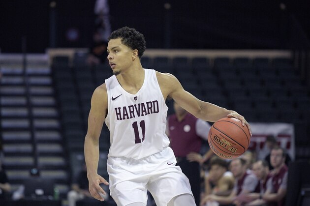Harvard guard Bryce Aiken (11) sets up a play during the first half of an NCAA college basketball game against Maryland Friday, Nov. 29, 2019, in Lake Buena Vista, Fla. (AP Photo/Phelan M. Ebenhack)