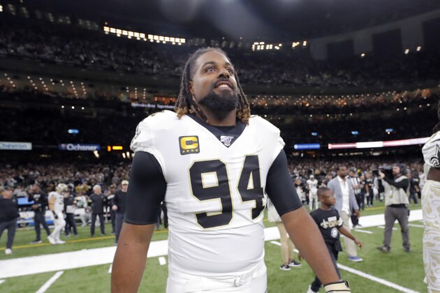 New Orleans Saints defensive end Cameron Jordan (94) walks on the field for the coin toss before an NFL wild-card playoff football game against the Minnesota Vikings, Sunday, Jan. 5, 2020, in New Orleans. The Vikings won 26-20. (AP Photo/Gerald Herbert)