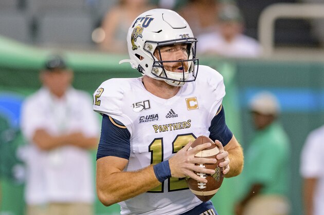 Florida International quarterback James Morgan (12) drops back to pass against Tulane during an NCAA football game on Thursday, Aug. 29, 2019 in New Orleans. (AP Photo/Matthew Hinton)