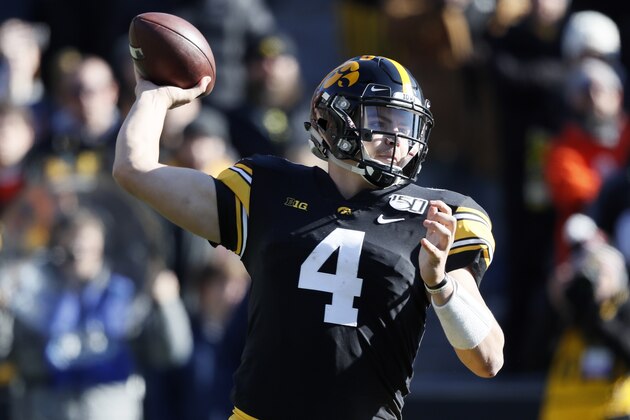 Iowa quarterback Nate Stanley throws a pass during the first half of an NCAA college football game against Illinois, Saturday, Nov. 23, 2019, in Iowa City, Iowa. (AP Photo/Charlie Neibergall)
