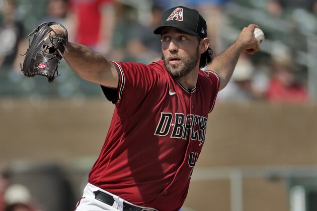Arizona Diamondbacks pitcher Madison Bumgarner throws during the second inning of spring training baseball game against the Cincinnati Reds, Thursday, Feb. 27, 2020, in Scottsdale Ariz. (AP Photo/Matt York)