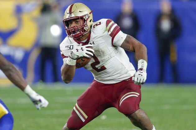 Boston College running back AJ Dillon (2) runs as Pittsburgh defensive back Jazzee Stocker (7) defends during the second half of an NCAA college football game, Saturday, Nov. 30, 2019, in Pittsburgh. Boston College won 26-19. (AP Photo/Keith Srakocic)