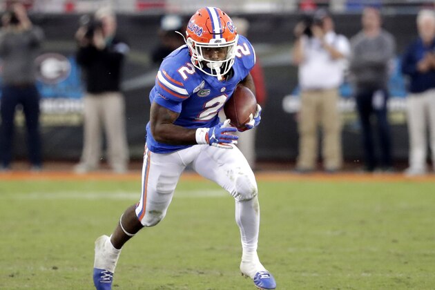 Florida running back Lamical Perine runs for yardage against Georgia during the second half of an NCAA college football game, Saturday, Nov. 2, 2019, in Jacksonville, Fla. (AP Photo/John Raoux)