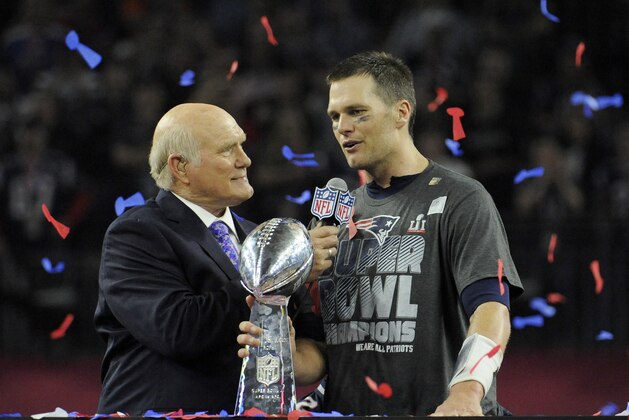 HOUSTON, TX - FEBRUARY 05: Tom Brady #12 of the New England Patriots with the Vince Lombardi trophy talks with Fox analyst Terry Bradshaw after the Patriots defeat the Atlanta Falcons 34-28 in overtime of Super Bowl 51 at NRG Stadium on February 5, 2017 in Houston, Texas. (Photo by Focus on Sport/Getty Images)