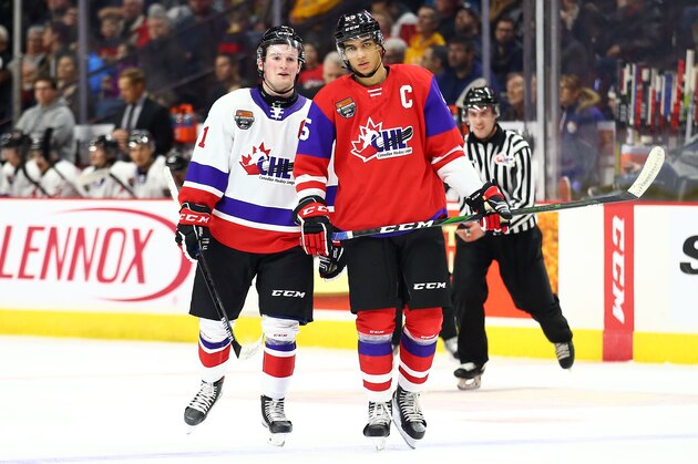 HAMILTON, ON - JANUARY 16:  Alexis Lafreniere #11 of Team White and Quinton Byfield #55 of Team Red talk during the third period of the 2020 CHL/NHL Top Prospects Game at FirstOntario Centre on January 16, 2020 in Hamilton, Canada.  (Photo by Vaughn Ridley/Getty Images)