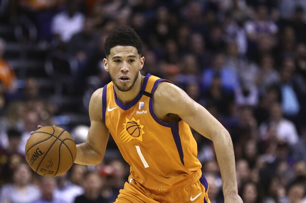Phoenix Suns guard Devin Booker dribbles the ball against the Portland Trail Blazers during the second half of an NBA basketball game Friday, March 6, 2020, in Phoenix. The Suns defeated the Trail Blazers 127-117. (AP Photo/Ross D. Franklin) Phoenix Suns guard Devin Booker dribbles the ball against the Portland Trail Blazers during the second half of an NBA basketball game Friday, March 6, 2020, in Phoenix. The Suns defeated the Trail Blazers 127-117. (AP Photo/Ross D. Franklin)