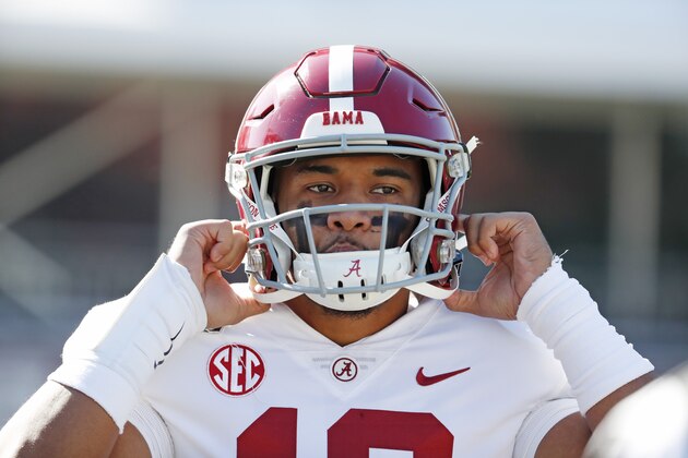 Alabama quarterback Tua Tagovailoa (13) adjusts his helmet before an NCAA college football game against Mississippi State in Starkville, Miss., Saturday, Nov. 16, 2019. (AP Photo/Rogelio V. Solis)