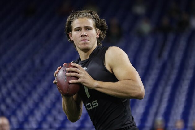 Oregon quarterback Justin Herbert runs a drill at the NFL football scouting combine in Indianapolis, Thursday, Feb. 27, 2020. (AP Photo/Michael Conroy)