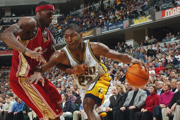 INDIANAPOLIS - NOVEMBER 7:  Ron Artest #23 of the Indiana Pacers looks to get by LeBron James #23 of the Cleveland Cavaliers at Conseco Fieldhouse on November 7, 2003 in Indianapolis, Indiana. The Pacer won 91-90.  NOTE TO USER: User expressly acknowledges and agress that, by downloading and or using this photograph, User is consenting to the terms and conditions of the Getty Images License Agreement.  (Photo by Ron Hoskins/NBAE via Getty Images)