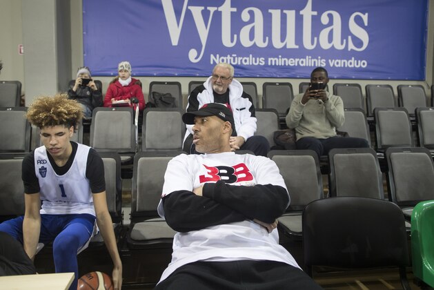 American basketball player LaMelo and his father LaVar Ball talk during the training session at the BC Prienai-Birstonas Vytautas arena in Prienai, Lithuania, Friday, Jan. 5, 2018. LiAngelo Ball and LaMelo Ball have signed a one-year contract to play for Lithuanian professional basketball club Prienai - Birstonas Vytautas, in the southern Lithuania town of Prienai, some 110 km (68 miles) from the Lithuanian capital Vilnius.(AP Photo/Mindaugas Kulbis)