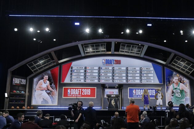 The draft board displays the picks for the first round in the NBA basketball draft Thursday, June 20, 2019, in New York. (AP Photo/Julio Cortez)