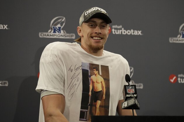 San Francisco 49ers tight end George Kittle wears a shirt showing quarterback Jimmy Garoppolo as he speaks at a news conference after the NFL NFC Championship football game against the Green Bay Packers Sunday, Jan. 19, 2020, in Santa Clara, Calif. The 49ers won 37-20 to advance to Super Bowl 54 against the Kansas City Chiefs. (AP Photo/Ben Margot)