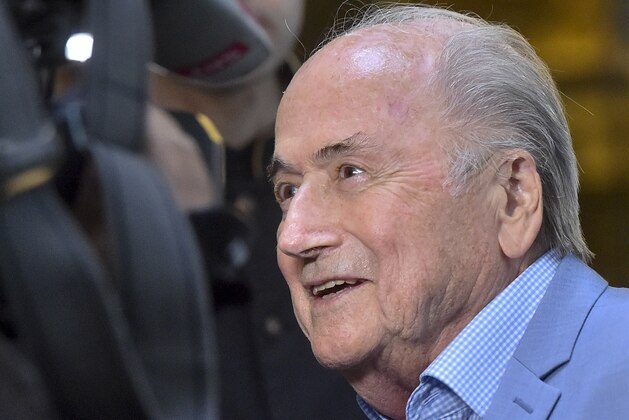 FILE - In this Tuesday, June 19, 2018 file photo, former FIFA President Joseph Blatter arrives at a hotel in Moscow, Russia. Suspended former FIFA president Sepp Blatter has arrived in Moscow for a World Cup visit at the invitation of Russian President Vladimir Putin. Five years into a sprawling investigation of soccer corruption, the first courtroom trial in Switzerland is due to begin Monday, March 9, 2020 in a 2006 World Cup fraud case. Sepp Blatter, the former FIFA president, and German soccer great Franz Beckenbauer are listed by Switzerland's federal criminal court to testify in the trial of four soccer officials implicated in a suspect 6.7 million euros ($7.6 million) payment. (AP Photo/Dmitry Serebryakov, file)