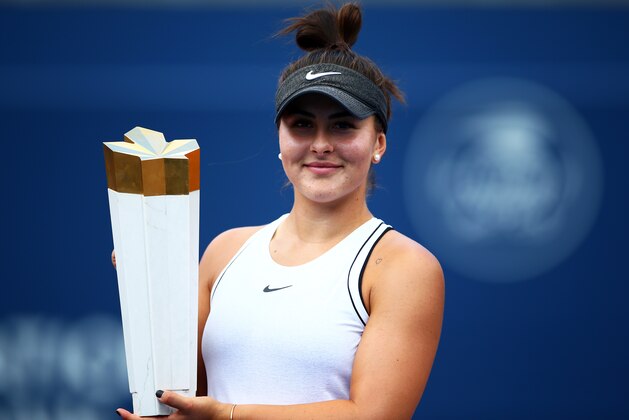TORONTO, ON - AUGUST 11:  Bianca Andreescu of Canada with the winners trophy following her victory over Serena Williams of the United States in the final match on Day 9 of the Rogers Cup at Aviva Centre on August 11, 2019 in Toronto, Canada. Williams withdrew from the match with a back injury.  (Photo by Vaughn Ridley/Getty Images)