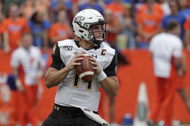 Towson quarterback Tom Flacco looks for a receiver against Florida during the first half of an NCAA college football game, Saturday, Sept. 28, 2019, in Gainesville, Fla. (AP Photo/John Raoux)