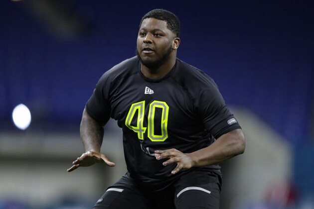 Michigan offensive lineman Cesar Ruiz runs a drill at the NFL football scouting combine in Indianapolis, Friday, Feb. 28, 2020. (AP Photo/Michael Conroy)