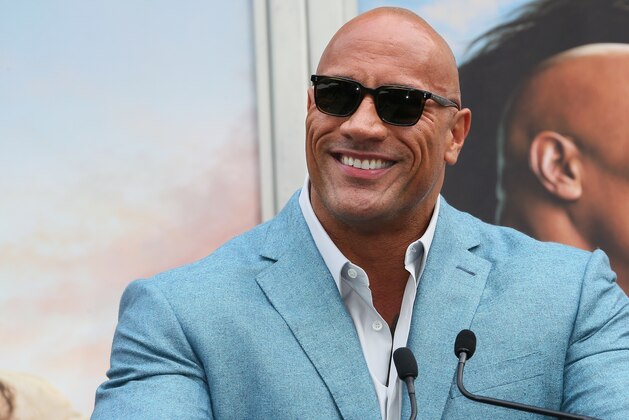 HOLLYWOOD, CALIFORNIA - DECEMBER 10: Dwayne Johnson attends a Hand and Footprint ceremony honoring Kevin Hart at the TCL Chinese Theatre IMAX on December 10, 2019 in Hollywood, California. (Photo by Jean Baptiste Lacroix/Getty Images)