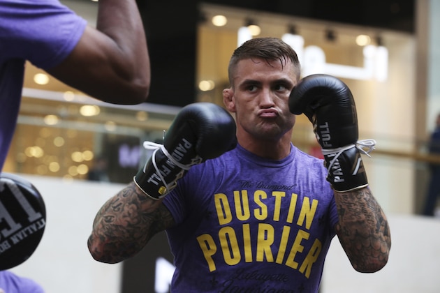 UFC fighter Dustin Poirier of Lafayette, Louisiana, spars with a partner during an open training session at Yas Mall in Abu Dhabi, United Arab Emirates, Wednesday, Sept. 4, 2019. Fighters Dustin Poirier and Khabib Nurmagomedov will face each other in UFC 242, which will be held Saturday, Sept. 7, 2019, in Abu Dhabi. (AP Photo/Jon Gambrell)