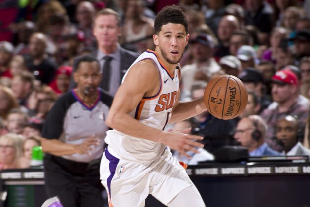 PORTLAND, OR - MARCH 10: Devin Booker #1 of the Phoenix Suns handles the ball against the Portland Trail Blazers on March 10 , 2020 at the Moda Center Arena in Portland, Oregon. NOTE TO USER: User expressly acknowledges and agrees that, by downloading and or using this photograph, user is consenting to the terms and conditions of the Getty Images License Agreement. Mandatory Copyright Notice: Copyright 2020 NBAE (Photo by Cameron Browne/NBAE via Getty Images)