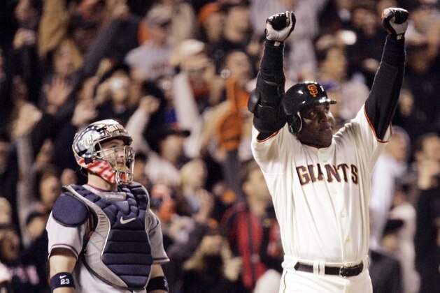 FILE - In this Aug. 7, 2007, file photo, San Francisco Giants Barry Bonds celebrates after his 756th career home run in the fifth inning of a baseball game against the Washington Nationals in San Francisco. Bonds will have his No. 25 jersey retired this August by the Giants when his former Pittsburgh Pirates are in town, the team announced Tuesday, Feb. 6, 2018. (AP Photo/Eric Risberg, File)