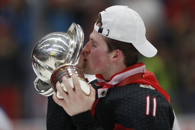 Canada's Alexis Lafreniere kisses the trophy after winning the U20 Ice Hockey Worlds gold medal match between Canada and Russia in Ostrava, Czech Republic, Sunday, Jan. 5, 2020. (AP Photo/Petr David Josek)